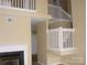 Spacious living room with fireplace and view to the upper level and the stairs at 1814 Birch Heights Ct, Charlotte, NC 28213