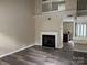 Spacious living room with hardwood flooring and a cozy fireplace, creating an inviting atmosphere at 1814 Birch Heights Ct, Charlotte, NC 28213
