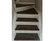 Elegant hardwood staircase with white trim, enhancing the home's interior design at 1814 Birch Heights Ct, Charlotte, NC 28213