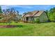 Well-maintained home exterior with stone accents and lush landscaping, enhancing its curb appeal at 2009 Freeport Dr, Indian Trail, NC 28079