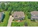 Beautiful home with a stone and siding exterior, a well-maintained lawn, and mature landscaping at 2009 Freeport Dr, Indian Trail, NC 28079