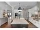Open concept kitchen with island seating that flows seamlessly into the living spaces at 2009 Freeport Dr, Indian Trail, NC 28079