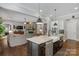 Kitchen with large island, stainless steel appliances, and open view to the living room at 2009 Freeport Dr, Indian Trail, NC 28079