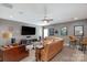 A spacious living room with a large screen TV, a tan leather sofa, and movie-themed decor at 2009 Freeport Dr, Indian Trail, NC 28079
