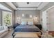This spacious main bedroom features a tray ceiling, neutral paint, and wood flooring at 2009 Freeport Dr, Indian Trail, NC 28079