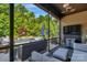 Relaxing screened-in patio featuring comfortable seating, ceiling fan, and views of the pool and backyard at 2009 Freeport Dr, Indian Trail, NC 28079