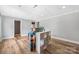 Basement room with light wood floors and neutral walls and a drop ceiling at 205 Honey Moss Ln, Salisbury, NC 28146