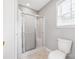 Bathroom featuring glass-enclosed shower and toilet at 205 Honey Moss Ln, Salisbury, NC 28146