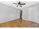 Bright bedroom with wood floors, ceiling fan, and neutral paint at 205 Honey Moss Ln, Salisbury, NC 28146