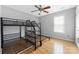 Bedroom with wood floors, ceiling fan, and bunk bed frame at 205 Honey Moss Ln, Salisbury, NC 28146