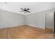 Bright bedroom features hardwood floors, ceiling fan, and neutral paint palette at 205 Honey Moss Ln, Salisbury, NC 28146