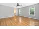 Large bedroom with hardwood floors and three windows for ample sunlight at 205 Honey Moss Ln, Salisbury, NC 28146