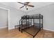 Bedroom with wood floors, ceiling fan, and bunk bed frame at 205 Honey Moss Ln, Salisbury, NC 28146