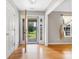 Bright entryway with hardwood floors and a view of the front yard through the open door at 205 Honey Moss Ln, Salisbury, NC 28146
