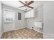 Functional laundry room equipped with a utility sink and storage cabinets at 205 Honey Moss Ln, Salisbury, NC 28146