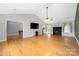 Spacious living room featuring hardwood floors, fireplace, and abundant natural light at 205 Honey Moss Ln, Salisbury, NC 28146