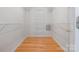 Walk-in closet with custom shelving and hardwood floors at 205 Honey Moss Ln, Salisbury, NC 28146