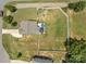 Aerial view of a home with large fenced backyard, patio with gazebo, and established landscaping at 2301 Amesbury Ct, Albemarle, NC 28001