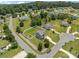 Aerial view of a gray two-story home in a residential neighborhood with mature trees and landscaping at 2301 Amesbury Ct, Albemarle, NC 28001