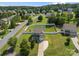 Aerial view of a gray two-story home with a large, fenced backyard and lush landscaping at 2301 Amesbury Ct, Albemarle, NC 28001