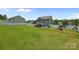 Backyard showcases a patio, play equipment and a white fence, perfect for relaxing and entertaining at 2301 Amesbury Ct, Albemarle, NC 28001
