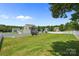 Expansive backyard features lush lawn, a gazebo, a white fence, and a play area creating a fun and relaxing space at 2301 Amesbury Ct, Albemarle, NC 28001