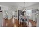 This dining room has a dark wood hutch, a table with four chairs, and wood flooring at 2301 Amesbury Ct, Albemarle, NC 28001