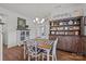 This dining room features a light fixture and wood floors, creating an inviting space for meals at 2301 Amesbury Ct, Albemarle, NC 28001