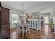 The dining room has great natural light, with wood flooring and decor at 2301 Amesbury Ct, Albemarle, NC 28001