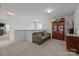 Open hallway area with cozy sofa, and wooden cabinet at 2301 Amesbury Ct, Albemarle, NC 28001