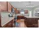 Bright kitchen featuring dark wood cabinetry, stainless steel appliances, ample counter space, and a center island at 2301 Amesbury Ct, Albemarle, NC 28001