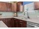 This kitchen features ample counter space, stainless steel appliances, and brown cabinetry at 2301 Amesbury Ct, Albemarle, NC 28001