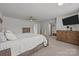 Spacious main bedroom with ceiling fan, and wall-mounted TV at 2301 Amesbury Ct, Albemarle, NC 28001