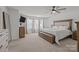 Spacious main bedroom with ceiling fan, and large windows at 2301 Amesbury Ct, Albemarle, NC 28001