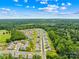 An aerial view showing an attractive neighborhood adjacent to a forest at 2512 Andes Dr, Statesville, NC 28625