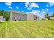 Expansive backyard with lush grass and a clear view of neighboring houses on a sunny day at 2512 Andes Dr, Statesville, NC 28625