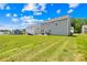 View of the exterior of the home showing the backyard and patio area at 2512 Andes Dr, Statesville, NC 28625