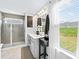 Modern bathroom features double sinks, vanity, walk-in shower, and natural light at 2512 Andes Dr, Statesville, NC 28625