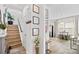 Welcoming entryway with hardwood flooring, staircase, and open view to the kitchen and dining area at 2512 Andes Dr, Statesville, NC 28625