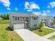 Beautiful two-story home featuring manicured lawn, attached garage, and welcoming front entrance at 2512 Andes Dr, Statesville, NC 28625