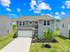 Lovely two-story home showcasing a neatly kept lawn, an attached garage, and inviting front entry at 2512 Andes Dr, Statesville, NC 28625