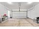 Spacious and clean garage featuring concrete flooring, ample ceiling height and storage shelves at 2512 Andes Dr, Statesville, NC 28625