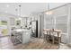 Open kitchen features an island with seating, a breakfast nook, and stainless steel appliances at 2512 Andes Dr, Statesville, NC 28625
