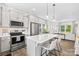 Well-lit kitchen features a center island, stainless appliances, and an open view to the living area at 2512 Andes Dr, Statesville, NC 28625