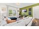 Bright living room featuring a comfortable couch, large windows, and stylish decor at 2512 Andes Dr, Statesville, NC 28625