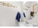 Stylish powder room features modern fixtures, a round mirror, and decorative wall art at 2512 Andes Dr, Statesville, NC 28625