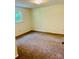 This bedroom has carpeted floors and a window offering great natural light at 2660 Tiffany St, Conover, NC 28613