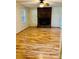 Spacious living room with hardwood floors, brick fireplace, and lots of natural light at 2660 Tiffany St, Conover, NC 28613
