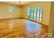Bright living room featuring hardwood floors and bay windows providing ample natural light at 2660 Tiffany St, Conover, NC 28613