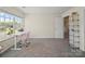 Bright bedroom featuring a large window and a comfortable workspace with a modern desk and chair at 404 Saddlebred Ln, Locust, NC 28097